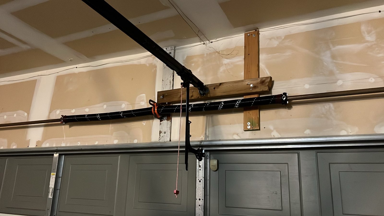 Torsion spring replacement on a residential garage door