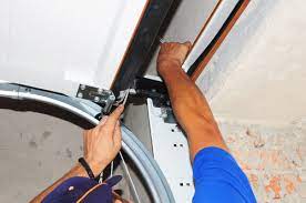 Professional garage door technician skillfully repairing the cable to restore the door's smooth and reliable function. With a focus on safety and attention to detail, the repair is executed with precision and expertise to ensure optimal performance of the garage door.