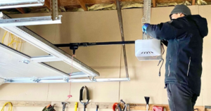 "Technician installing a garage door opener."